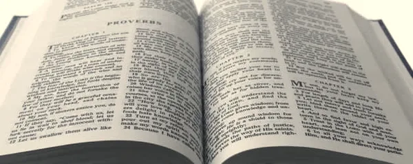 An open Bible showing the Book of Proverbs